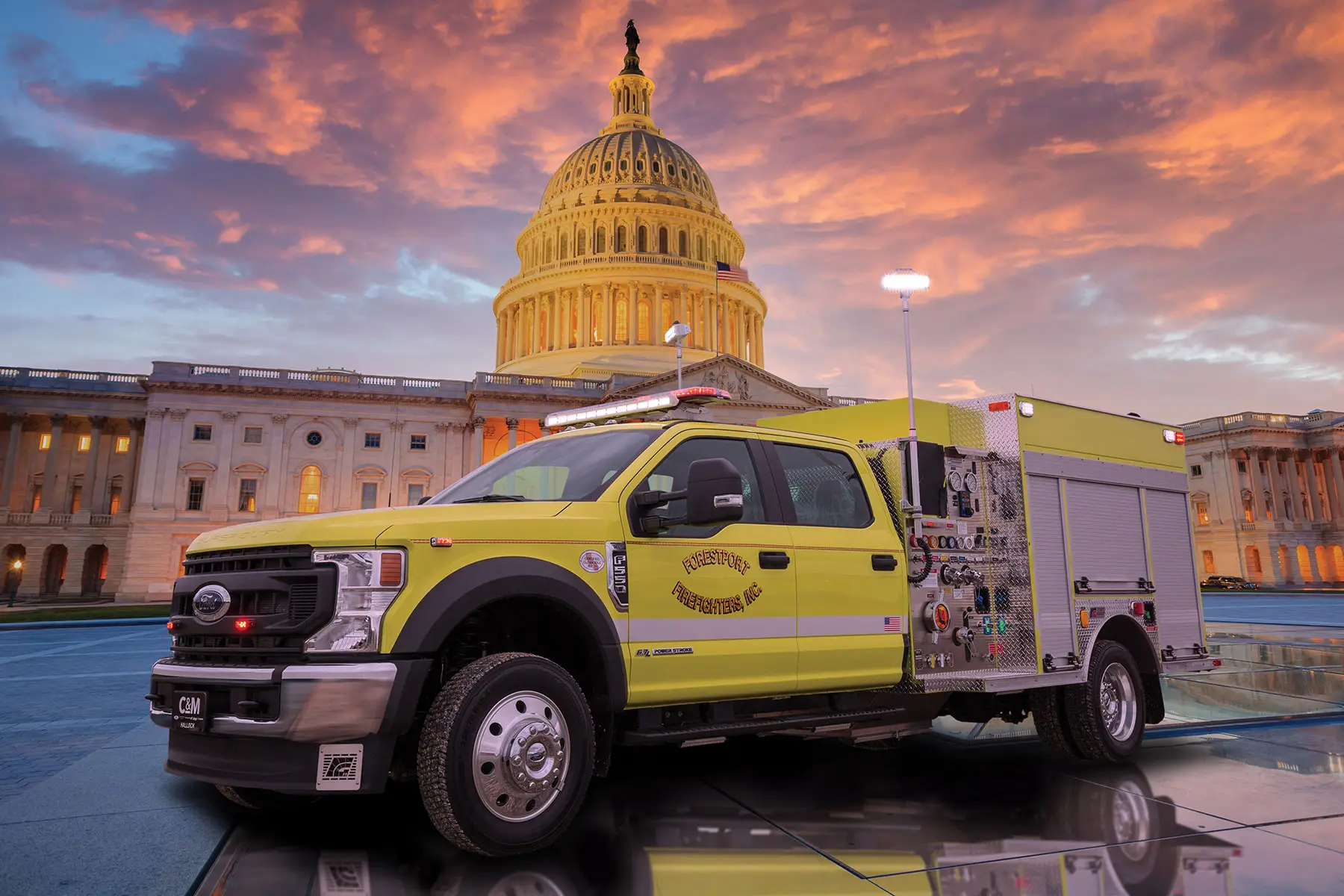 The United States Capitol building with the dome lit up at night.